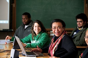 Professor laughing with two students