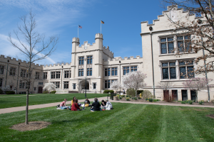 Kauke Hall with small class in a circle in foreground
