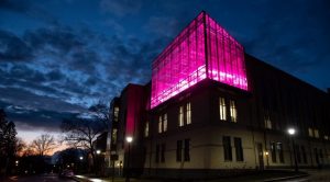 Building with pink light from inside