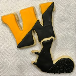 Ices sugar cookies in the shape of black and yellow W and a black squirrel